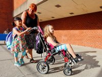 1009397793 ma nb HayMacFistDay  Jennifer Cummings helps her students, Katharina Lui, and Julia Berry make their way into school for their first day of school at the Hayden McFadden Elementary School in New Bedford.  PETER PEREIRA/THE STANDARD-TIMES/SCMG : education, school, students